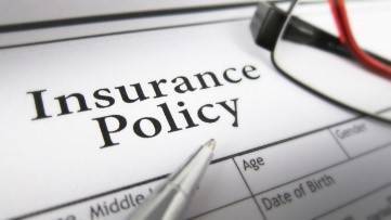 Document with Insurance Policy written on it